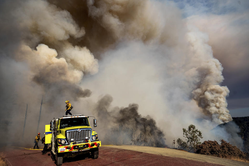 Firefighters battle the Mosquito Fire along Mosquito Ridge Rd. near the Foresthill community in Placer County, Calif., on Thursday, Sept. 8, 2022. (AP Photo/Noah Berger)