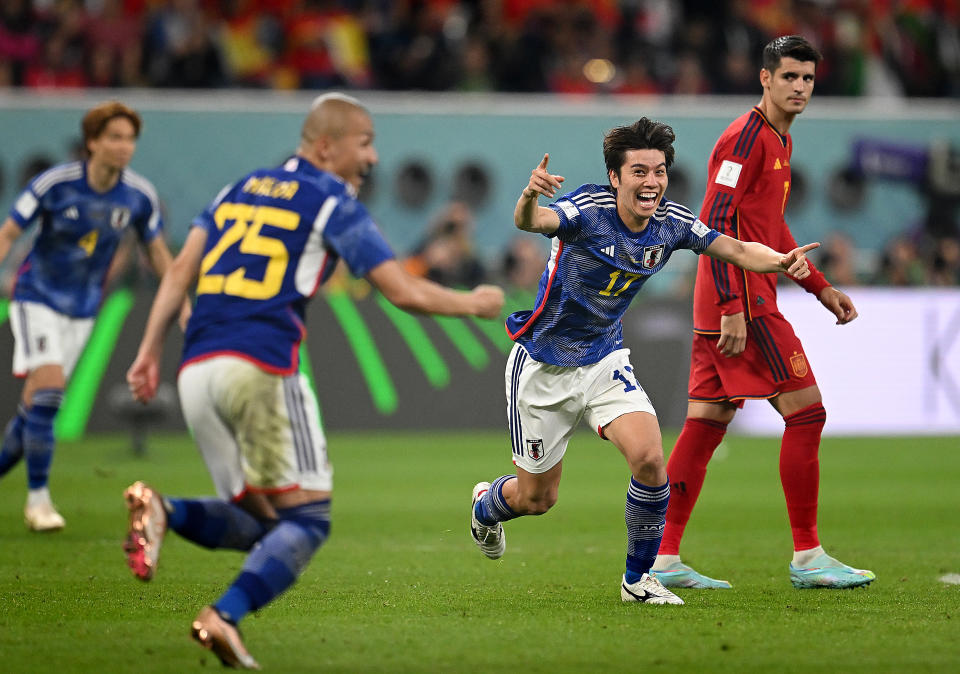 DOHA, QATAR - DECEMBER 01: Ao Tanaka of Japan celebrates after scoring the team's second goal during the FIFA World Cup Qatar 2022 Group E match between Japan and Spain at Khalifa International Stadium on December 01, 2022 in Doha, Qatar. (Photo by Clive Mason/Getty Images)