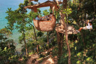 <p>Tuck into your slap-up meal where few other people would - high up in the trees. Tucked away on the secluded Thai island of Koh Kut, <a href="http://www.healthandfitnesstravel.com/destinations/asia/thailand/soneva-kiri/" rel="nofollow noopener" target="_blank" data-ylk="slk:Soneva Kiri;elm:context_link;itc:0;sec:content-canvas" class="link ">Soneva Kiri</a> offers Treepod Dining, where you dine on gourmet delights delivered by a waiter via zip-line. Work it off with daily activities such as tailor-made yoga and fitness programmes.<i> [Photo: Health and Fitness Travel]</i></p>
