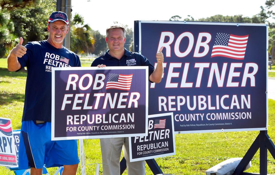 Supporter Brian Blickley with Rob Feltner, candidate for county commissioner. Scenes of candidates, supporters, and voters in various parts of south Brevard County during the August 23, 2022 elections. 