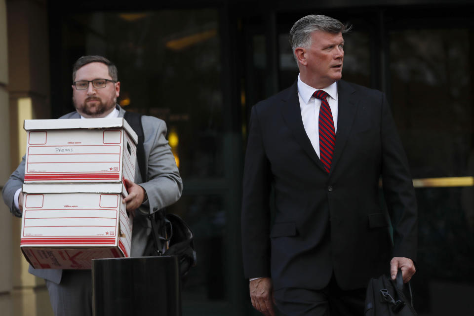 Kevin Downing, right, an attorney representing Lev Parnas and Igor Fruman, leaves the federal courthouse in Alexandria, Va., Thursday, Oct. 10, 2019.(AP Photo/Pablo Martinez Monsivais)