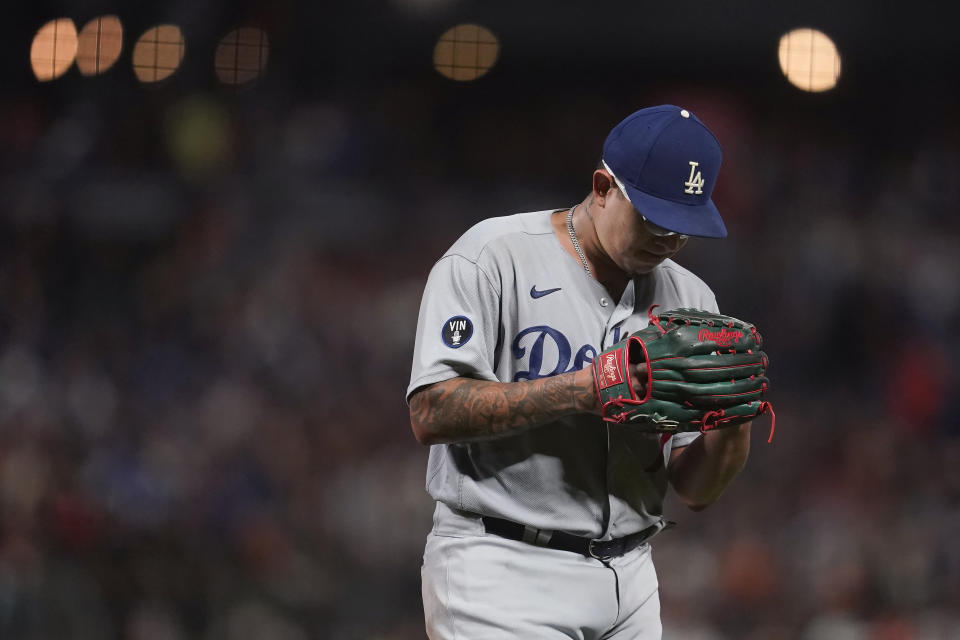 Los Angeles Dodgers pitcher Julio Urias walks toward the dugout after retiring the San Francisco Giants during the sixth inning of a baseball game in San Francisco, Saturday, Sept. 17, 2022. (AP Photo/Jeff Chiu)