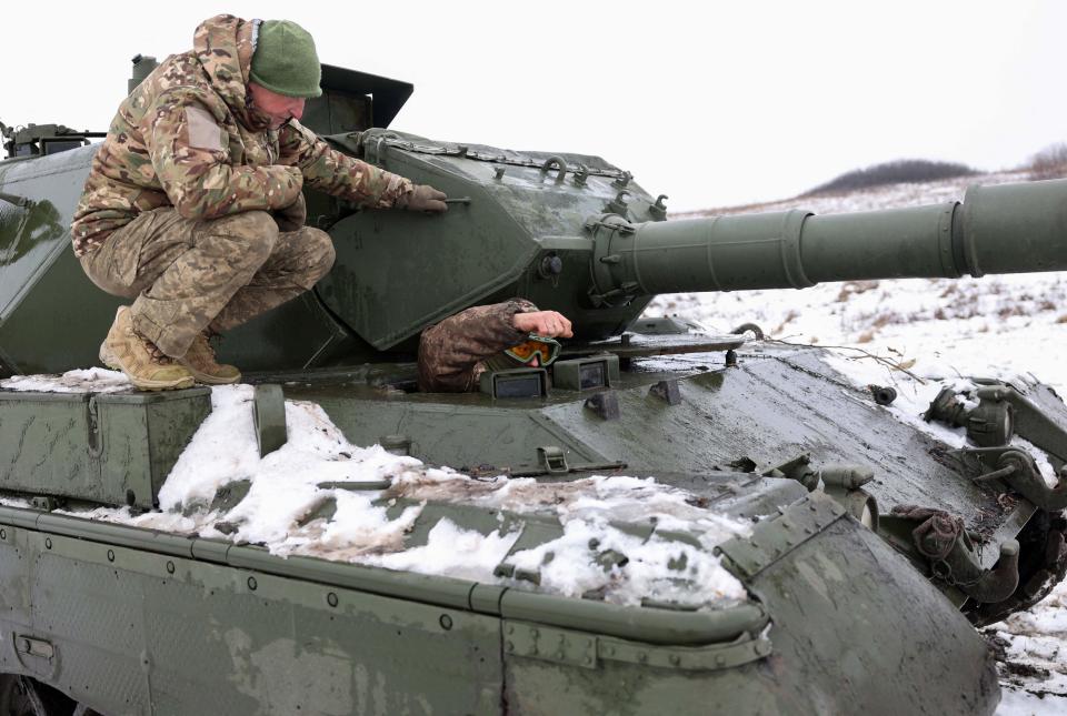 Ukrainian tankists stand on a tank Leopard 1A5 not far from the front line in Kharkiv region (AFP via Getty Images)