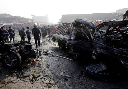 FILE PHOTO: Wreckage is seen at the site of a car bomb attack at a vegetable market in eastern Baghdad, Iraq January 8, 2017. REUTERS/Wissm al-Okili/File Photo
