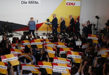 Christian Democratic Union CDU party leader and German Chancellor Angela Merkel reacts during the German general election (Bundestagswahl) in Berlin, Germany, September 24, 2017. REUTERS/Pawel Kopczynski