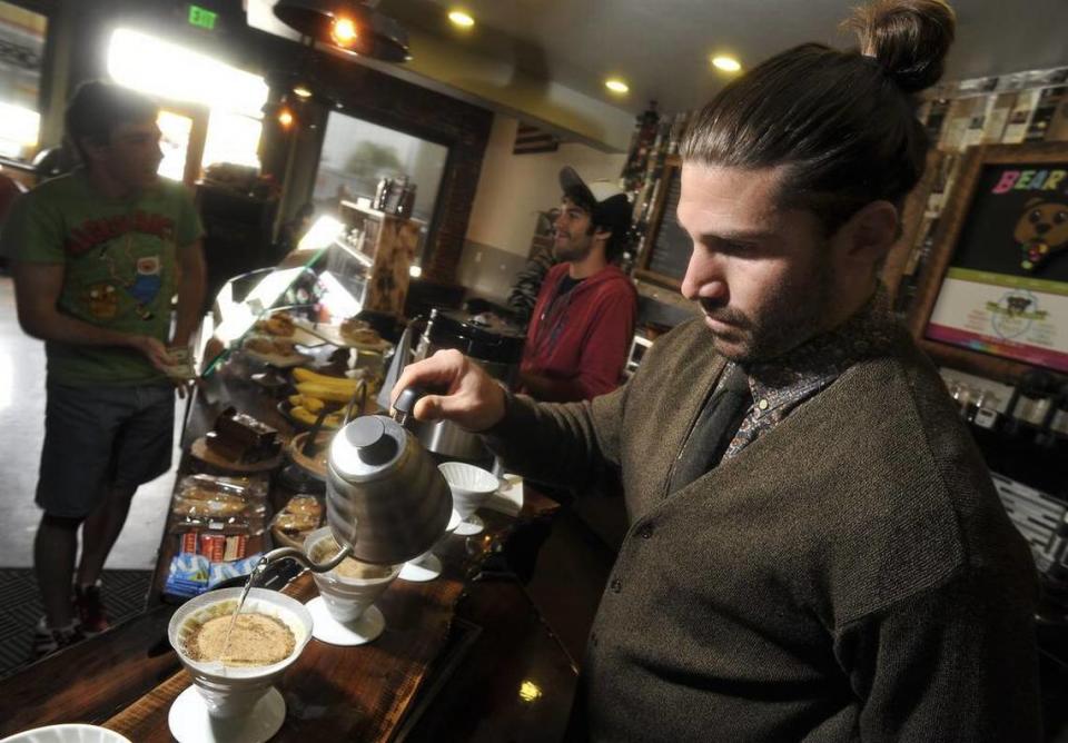 Zack Follett prepares coffee drinks at the original Kuppa Joy location in Old Town Clovis in this file photo from 2014. He’s a former NFL linebacker and Clovis High graduate.