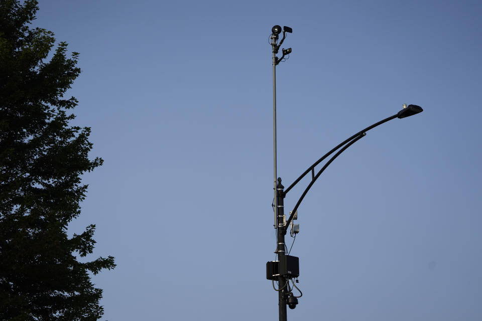 FILE - ShotSpotter equipment overlooks the intersection of South Stony Island Avenue and East 63rd Street in Chicago on Tuesday, Aug. 10, 2021. In more than 140 cities across the United States in 2023, ShotSpotter’s artificial intelligence algorithm and its intricate network of microphones evaluate hundreds of thousands of sounds a year to determine if they are gunfire, generating data now being used in criminal cases nationwide. (AP Photo/Charles Rex Arbogast, File)