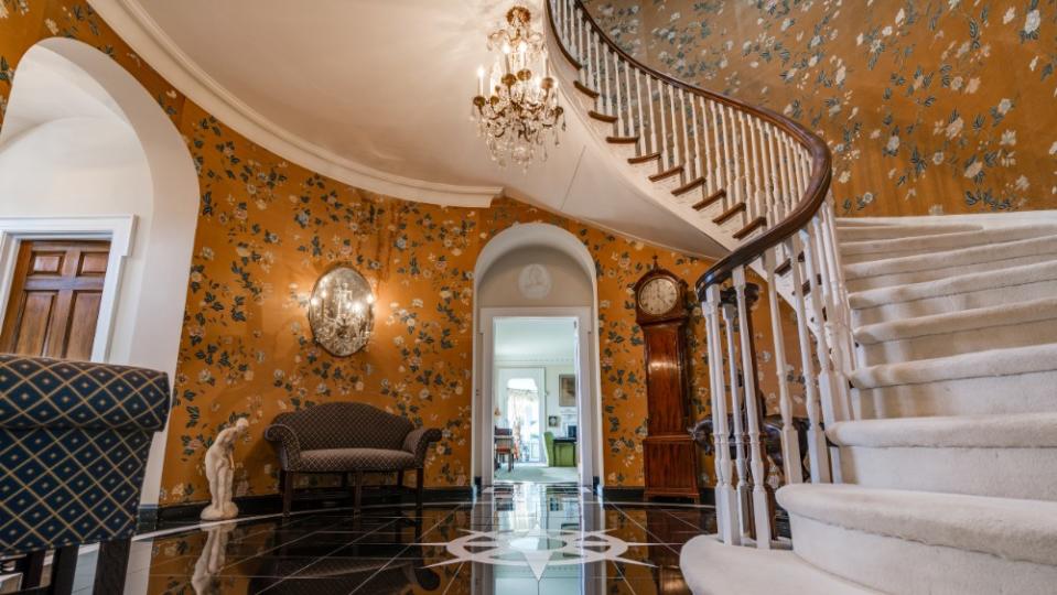 The spiral staircase remains from when the estate was built in 1935. - Credit: Douglas Elliman