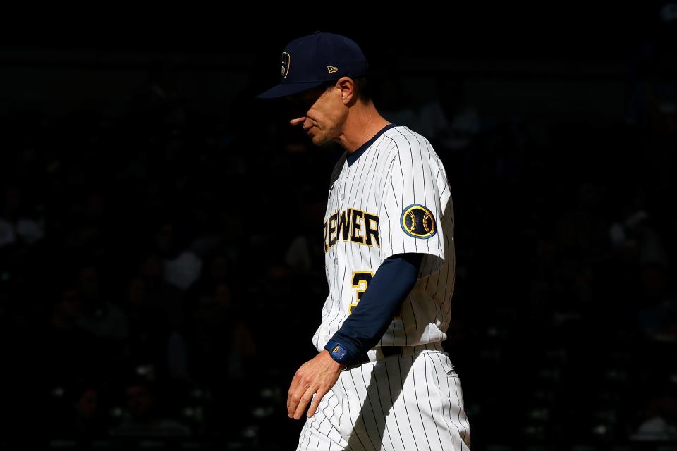 Brewers manager Craig Counsell makes a pitching change in the seventh inning against the Miami Marlins at American Family Field on Sunday.