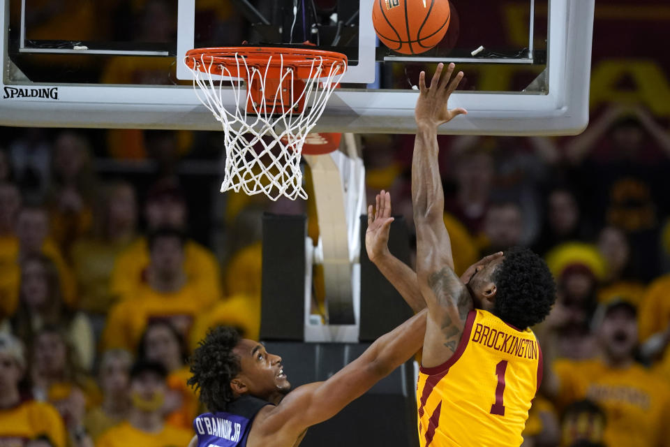 TCU forward Chuck O'Bannon Jr., left, tries to block a shot by Iowa State guard Izaiah Brockington (1) during the second half of an NCAA college basketball game, Saturday, Jan. 22, 2022, in Ames, Iowa. (AP Photo/Charlie Neibergall)