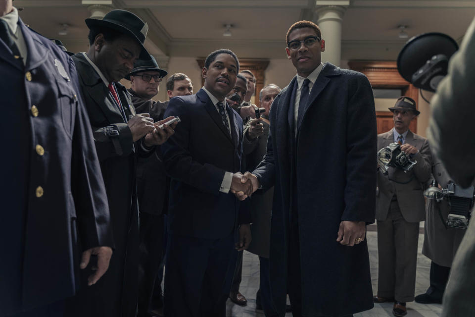 Martin Luther King Jr., played by Kelvin Harrison Jr., and Malcolm X, played by Aaron Pierre, are surrounded by reporters in the Senate as seen in GENIUS: MLK/X. (Richard DuCree / National Geographic)