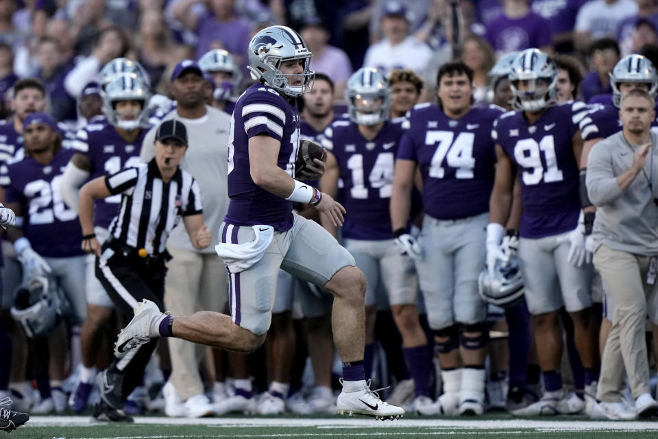 Kansas State quarterback Will Howard (18) runs the ball during the first half of an NCAA college football game against TCU Saturday, Oct. 21, 2023, in Manhattan, Kan. (AP Photo/Charlie Riedel)