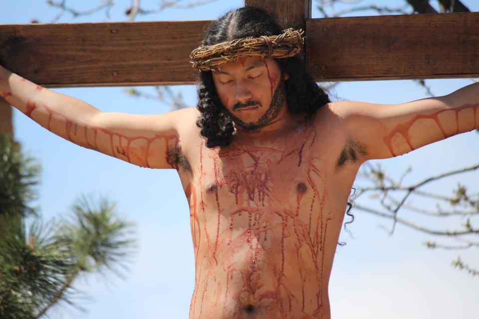 Lui Patino, 15, portrays Jesus as Our Lady of Grace Catholic Church in Lubbock observes Stations of the Cross and re-enacts the crucifixion of Christ on Good Friday.