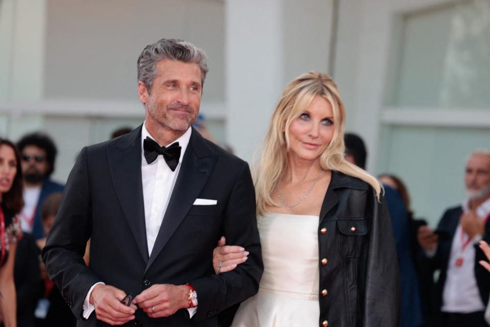 Patrick Dempsey and Jillian Fink attend "Ferrari" Red Carpet - The 80th Venice International Film Festival