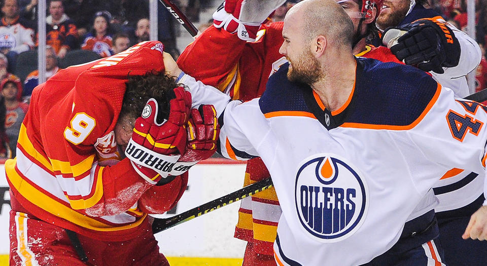 CALGARY, AB - JANUARY 11: Zack Kassian #44 of the Edmonton Oilers fights Matthew Tkachuk #19 of the Calgary Flames during an NHL game at Scotiabank Saddledome on January 11, 2020 in Calgary, Alberta, Canada. (Photo by Derek Leung/Getty Images) 