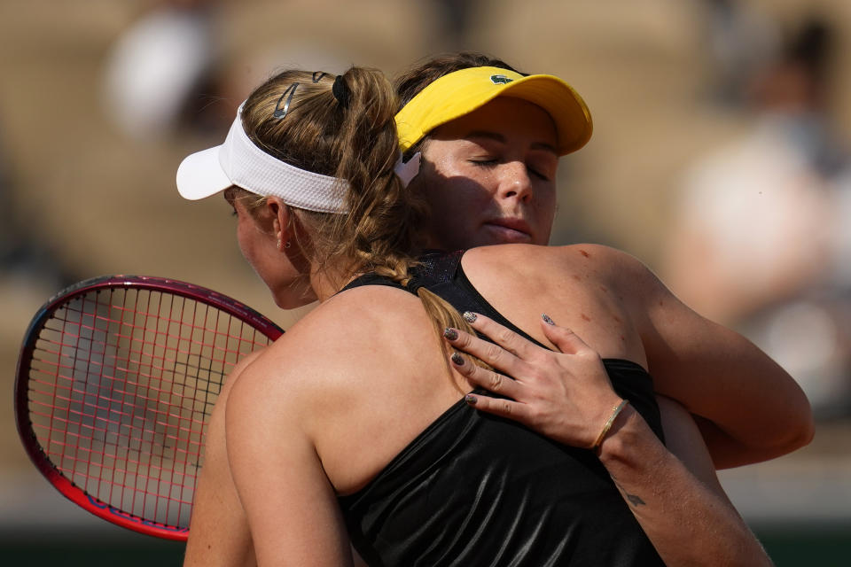 Russia's Anastasia Pavlyuchenkova, right, hugs Kazakhstan's Elena Rybakina after winning their quarterfinal match of the French Open tennis tournament at the Roland Garros stadium Tuesday, June 8, 2021 in Paris. (AP Photo/Christophe Ena)