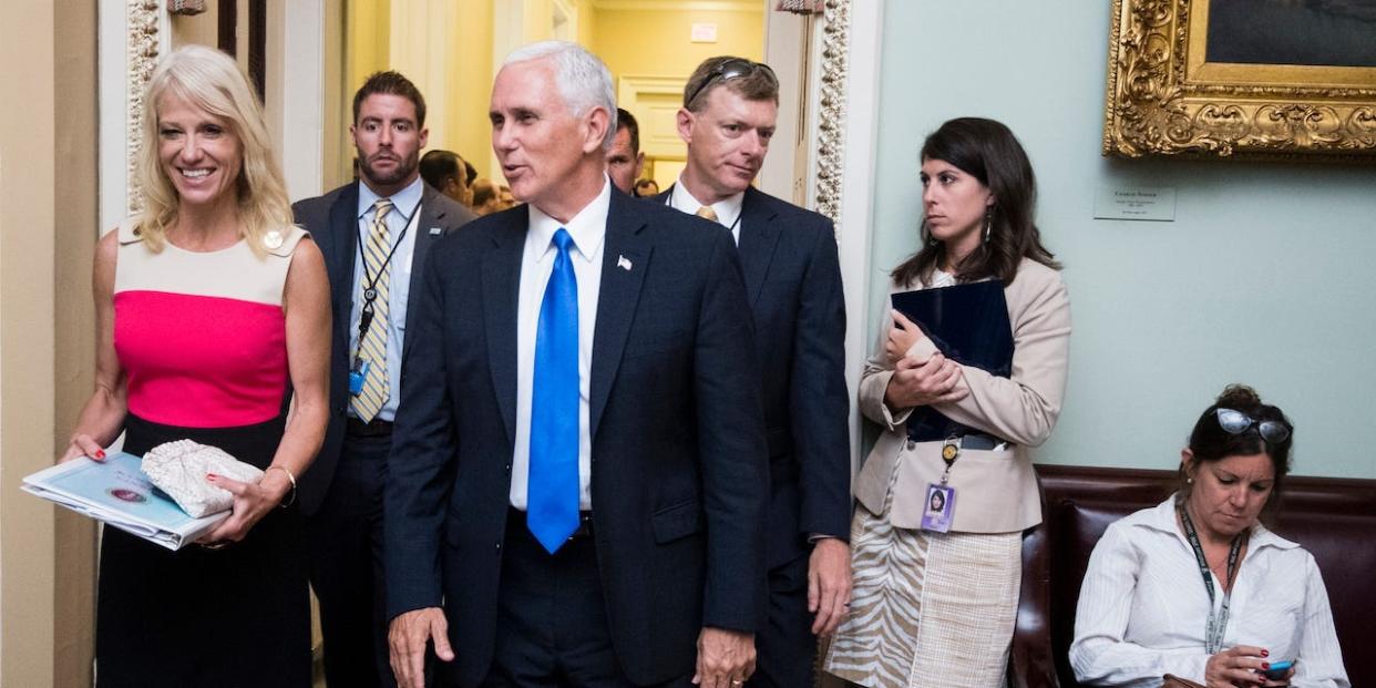 Kellyanne Conway, Counselor to President Donald Trump, and Vice President Mike Pence talk as they leave the Senate Republicans' policy lunch in the Capitol on Tuesday, July 11, 2017.