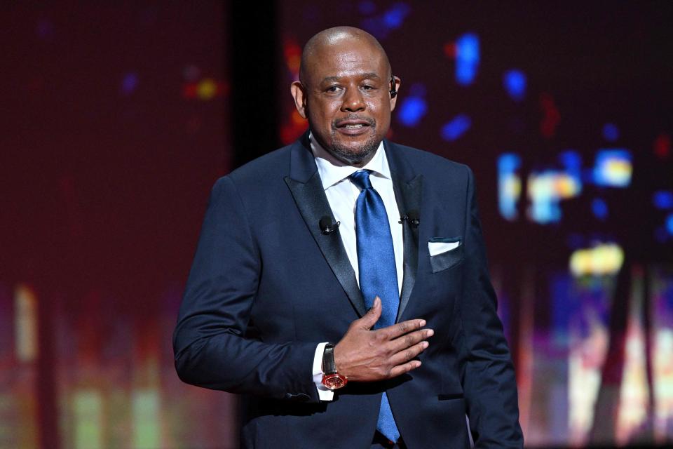 US actor Forest Whitaker delivers a speech before being awarded with an Honorary Palm D'Or during the Opening Ceremony of the 75th edition of the Cannes Film Festival in Cannes, southern France, on May 17, 2022. (Photo by CHRISTOPHE SIMON / AFP) (Photo by CHRISTOPHE SIMON/AFP via Getty Images) ORG XMIT: 0 ORIG FILE ID: AFP_32AB8WB.jpg