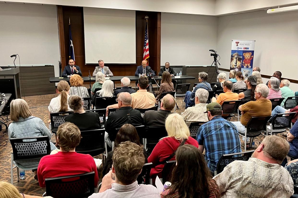 Lubbock mayoral candidates answer questions during the Texas Tech Public Media mayoral forum Monday at Mahon Library.