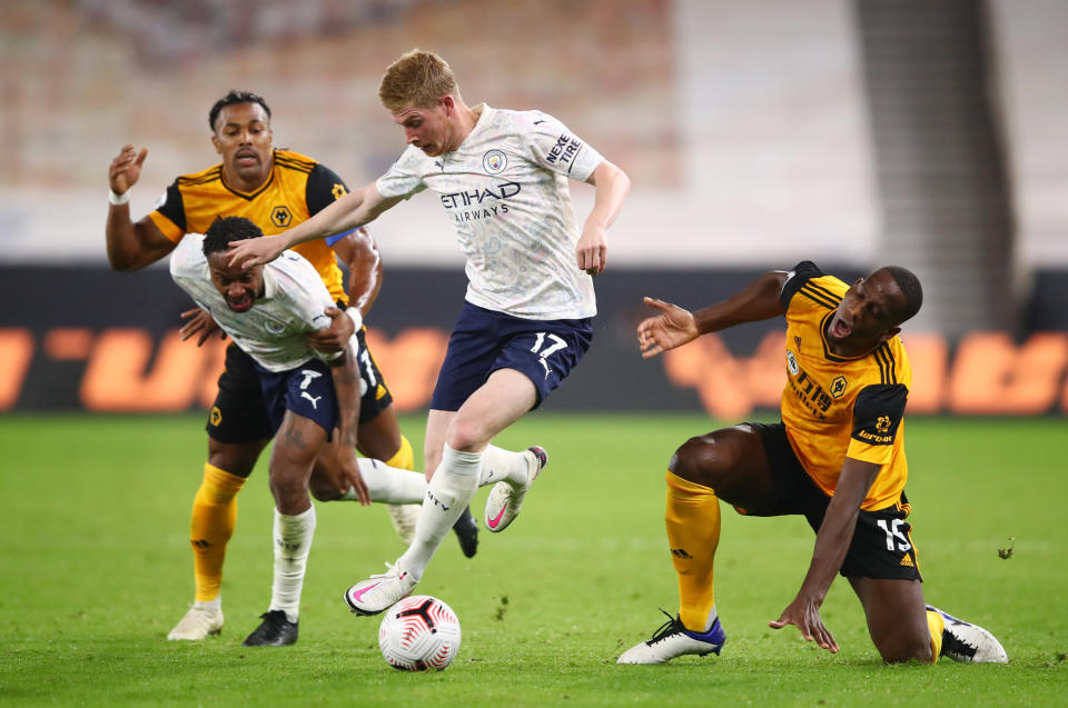 Soccer Football - Premier League - Wolverhampton Wanderers v Manchester City - Molineux Stadium, Wolverhampton, Britain - September 21, 2020 Manchester City's Kevin De Bruyne and Raheem Sterling in action with Wolverhampton Wanderers' Adama Traore and Willy Boly Pool via REUTERS/Marc Atkins EDITORIAL USE ONLY. No use with unauthorized audio, video, data, fixture lists, club/league logos or 'live' services. Online in-match use limited to 75 images, no video emulation. No use in betting, games or single club/league/player publications.  Please contact your account representative for further details.