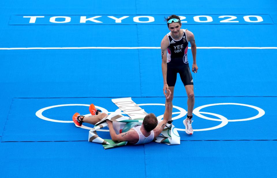 Alex Yee congratulates winner Kristian Blummenfelt at the finish line (Martin Rickett/PA) (PA Wire)