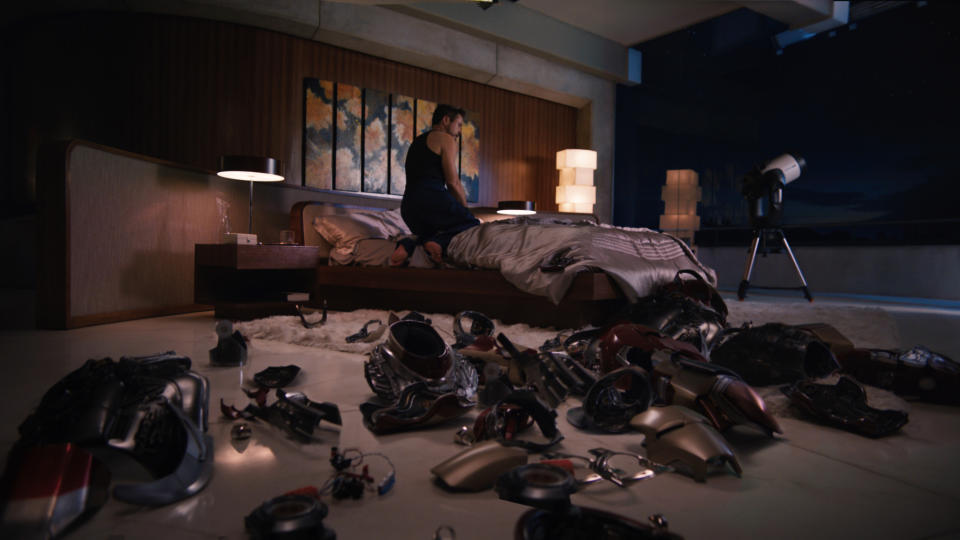 This undated image provided by Disney-Marvel Studios shows a lamp designed by the late sculptor Isamu Noguchi illuminating Tony Stark's/Iron Man's (Robert Downey Jr.) bedroom in the movie, "Iron Man 3." The lamp's striking geometric design -- a series of irregularly stacked white boxes -- can be seen to the right of the bed. The production designer for "Iron Man 3," Danielle Berman, says she loves using Noguchi lamps in sets when appropriate because of their linear modernist look and because of the soft glow they emit when lit. (AP Photo/Disney, Marvel Studios, Film Frame)