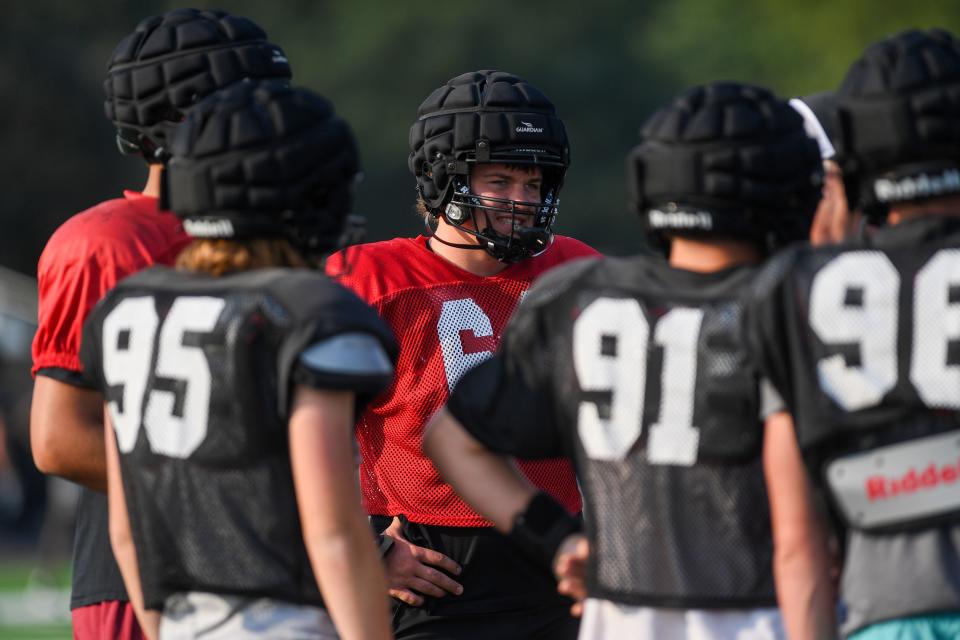 Hudson Parliament (64) listens to coach during practice at Brandon Valley High School in Brandon, South Dakota on Friday, Aug. 18, 2023. Parliament had 31 tackles last season, five for a loss.