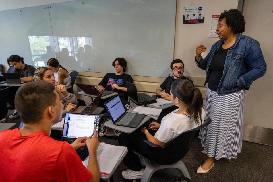 Clinical Assistant Professor, Charity Watson, right, answers a question from a group during Calculus I class at FIU. Miami, Florida, August 31, 2023 -