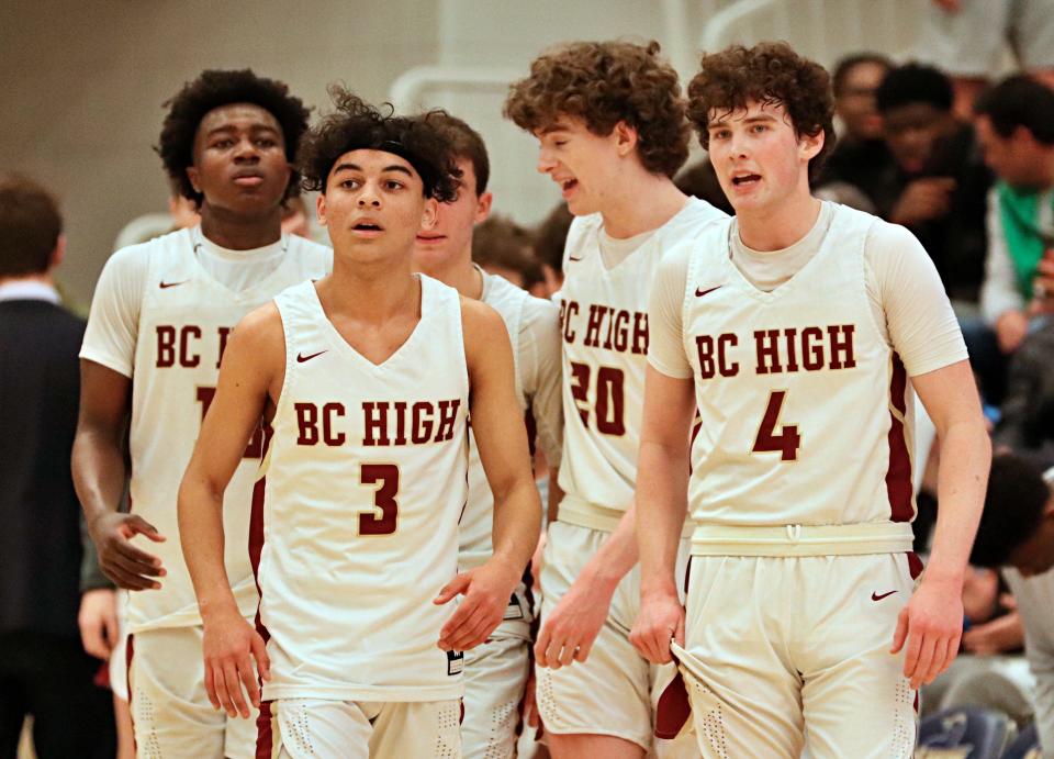 BC High's starting five, led by Greg Cooper, front left, and Mike Loughnane, right, against Springfield Central in the Division 1 state semifinals at Worcester State University on Wednesday, March 16, 2022.