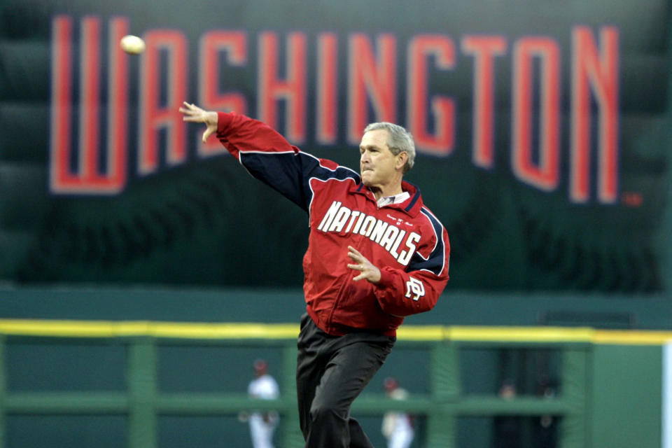 FILE - In this April 14, 2005, file photo, President George W. Bush throws out the ceremonial first pitch at the Washington Nationals home opener in Washington. The Nationals play the Arizona Diamondbacks in the first regular season baseball game in Washington in 34 years. (AP Photo/Evan Vucci, file)