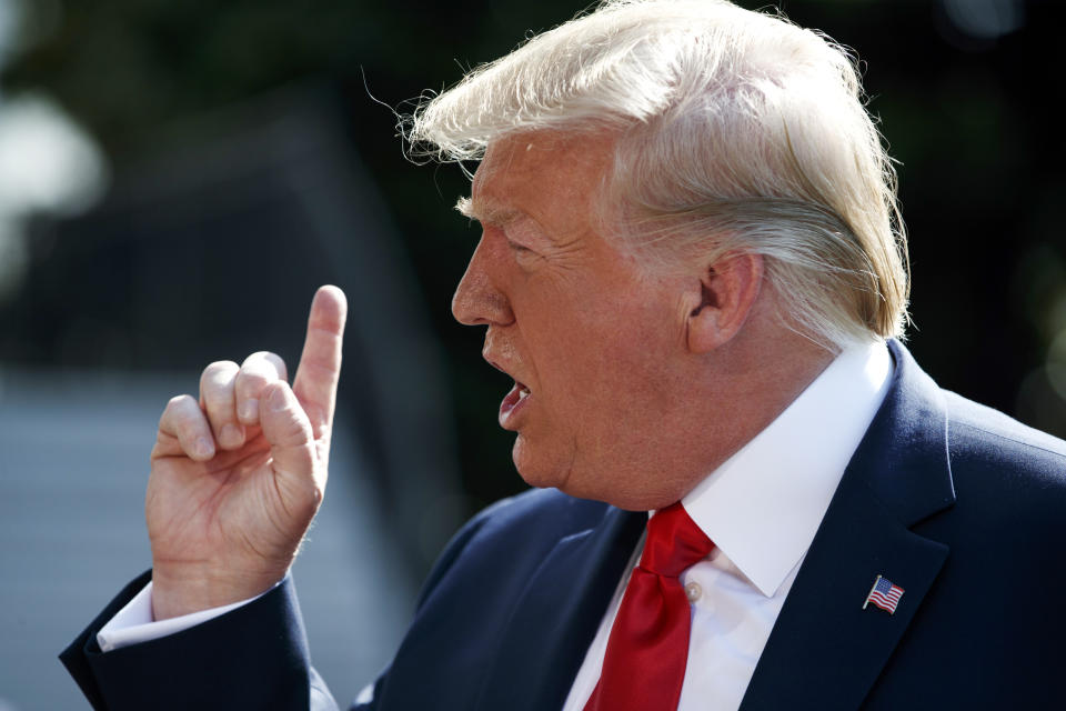 President Donald Trump talks to reporters on the South Lawn of the White House, Friday, Aug. 9, 2019, in Washington, as he prepares to leave Washington for his annual August holiday at his New Jersey golf club. (AP Photo/Evan Vucci)