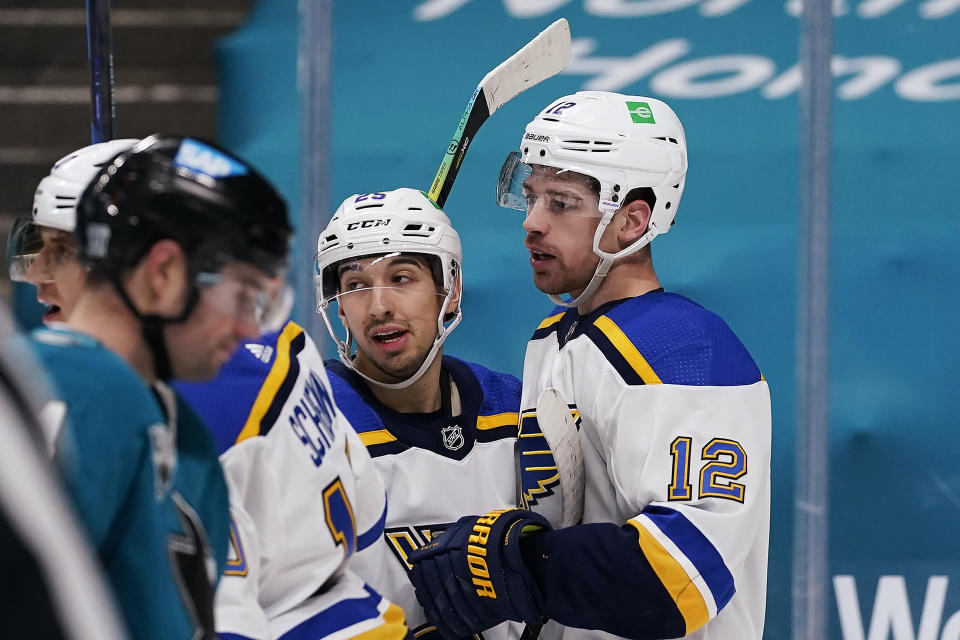 St. Louis Blues left wing Zach Michael Sanford (12) is congratulated by Jordan Kyrou (25) after scoring a goal against the San Jose Sharks during the second period of an NHL hockey game in San Jose, Calif., Saturday, Feb, 27, 2021. (AP Photo/Tony Avelar)