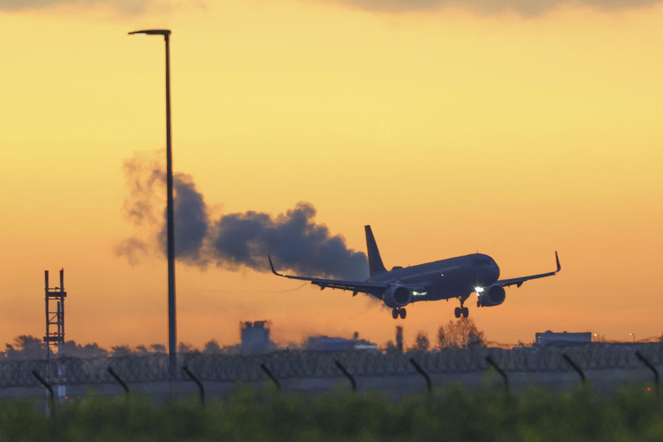 An Air Force Airbus carrying German citizens evacuated from Sudan lands at Berlin Brandenburg Airport in Schonefeld, Germany, Monday, April 24, 2023. (J'rg Carstensen/dpa via AP)