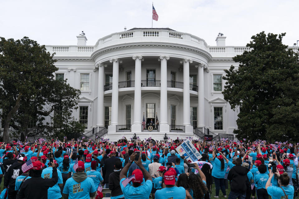 President Donald Trump speaks from the Blue Room Balcony of the White House to a crowd of supporters, Saturday, Oct. 10, 2020, in Washington. (AP Photo/Alex Brandon)