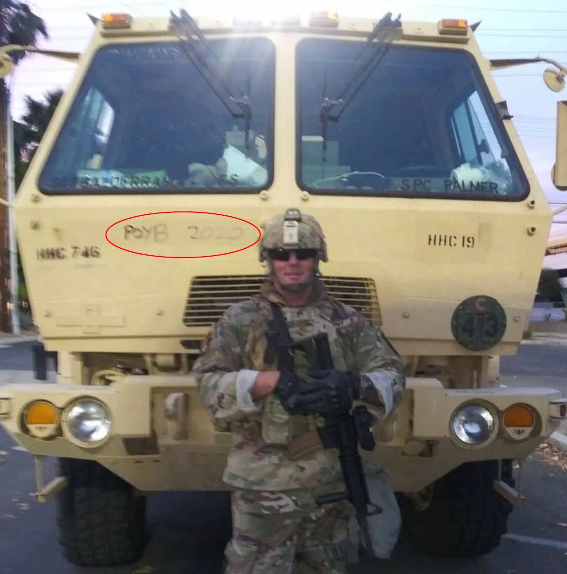 Sgt. Brian Jackson of the California National Guard posted this Facebook photo on June 2 while deployed to police Black Lives Matter protests in Los Angeles. It shows him standing in front of a military vehicle inscribed with a slogan for the Proud Boys, a neo-fascist group. (Photo: Facebook)
