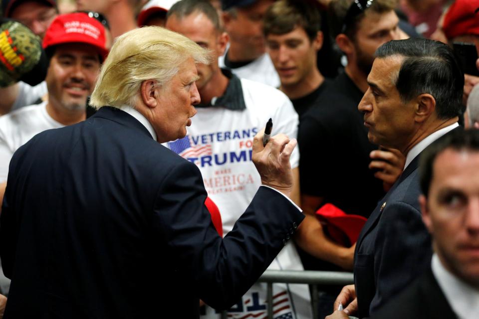 Republican presidential candidate Donald Trump (left) speaks with U.S. Representative Darrell Issa (right) after a rally with supporters in San Diego, Calif., on May 27, 2016. (Photo: Jonathan Ernst/Reuters)