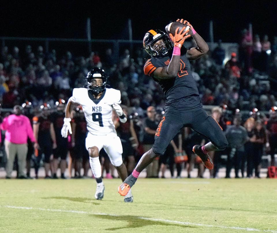Spruce Creek's Tony Kinsler (2) makes the reception and runs to score a touchdown during a game with New Smyrna Beach at Spruce Creek High School in Port Orange, Friday, Oct. 20, 2023.