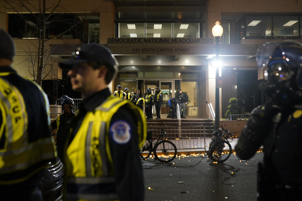 U.S. Capitol Police stand outside the headquarters of the Democratic National Committee Wednesday, Nov. 15, 2023, in Washington.(AP Photo/Nathan Howard)