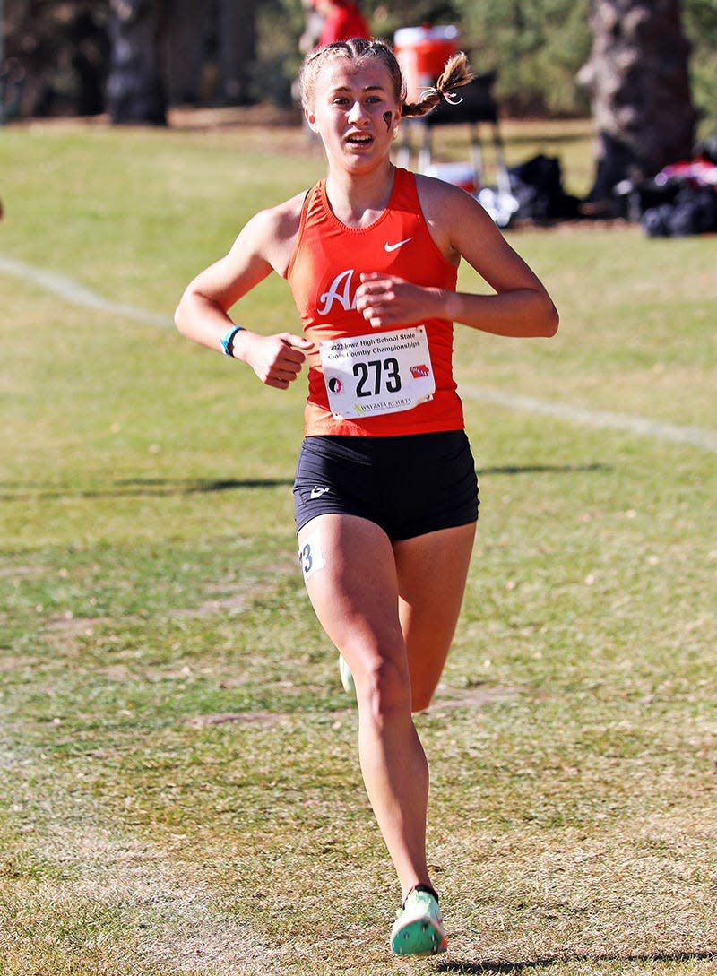 Ames sophomore Marley Turk (273) runs during the 4A girls race at the state co-ed cross country meet Saturday at the Lakeside Municipal Golf Course at Kennedy Park in Fort Dodge. Turk earned a medal after placing ninth individually.