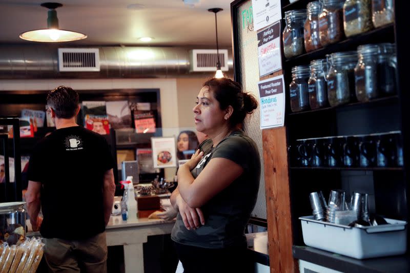 FILE PHOTO: Alcira Perez, a dish washer of nine years at Farley’s East cafe that closed due to the financial crisis caused by the coronavirus disease (COVID-19), stands during an employee meeting at the cafe in Oakland