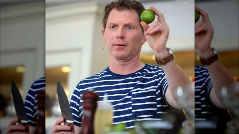 Bobby Flay holding lime and knife