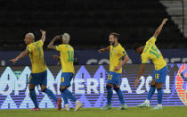 Brazil's Richarlison, left, celebrates with teammates after scoring his side's 4th goal during a Copa America soccer match against Peru at Nilton Santos stadium in Rio de Janeiro, Brazil, Thursday, June 17, 2021. (AP Photo/Silvia Izquierdo)