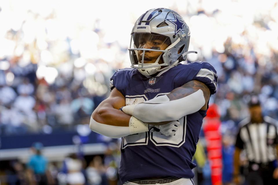 Dallas Cowboys' Tony Pollard reacts after rushing for a touchdown during the first half of an NFL football game against the Chicago Bears Sunday, Oct. 30, 2022, in Arlington, Texas. (AP Photo/Ron Jenkins)