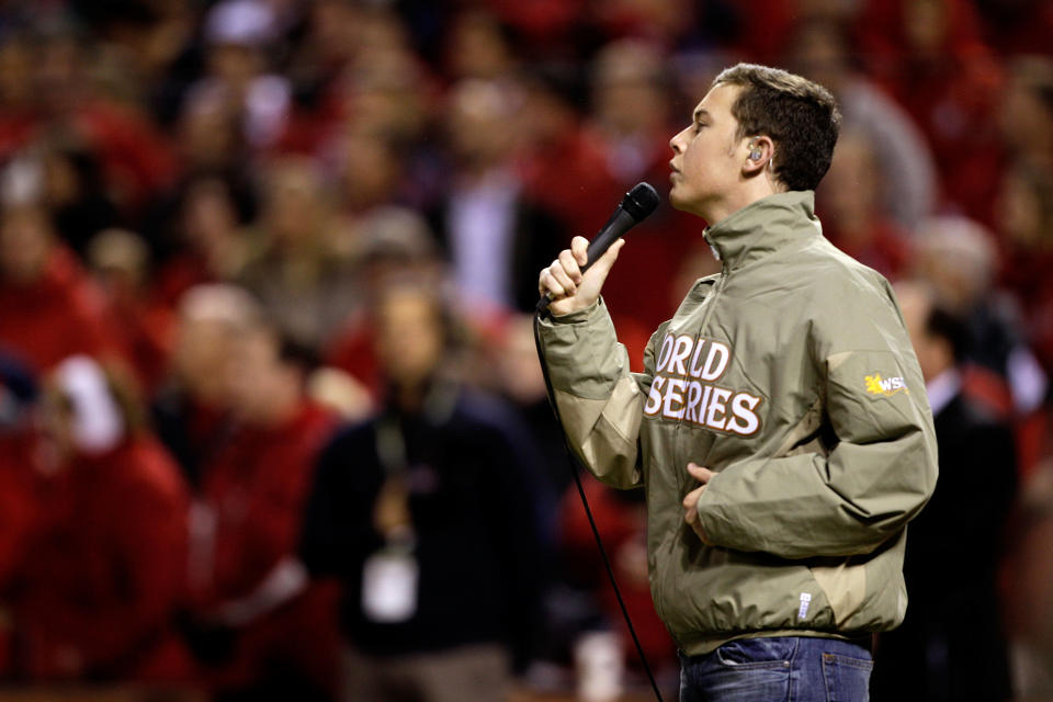 ST LOUIS, MO - OCTOBER 19: American Idol winner Scotty McCreery sings the national anthem prior to Game One of the MLB World Series between the Texas Rangers and the St. Louis Cardinals at Busch Stadium on October 19, 2011 in St Louis, Missouri. (Photo by Rob Carr/Getty Images)