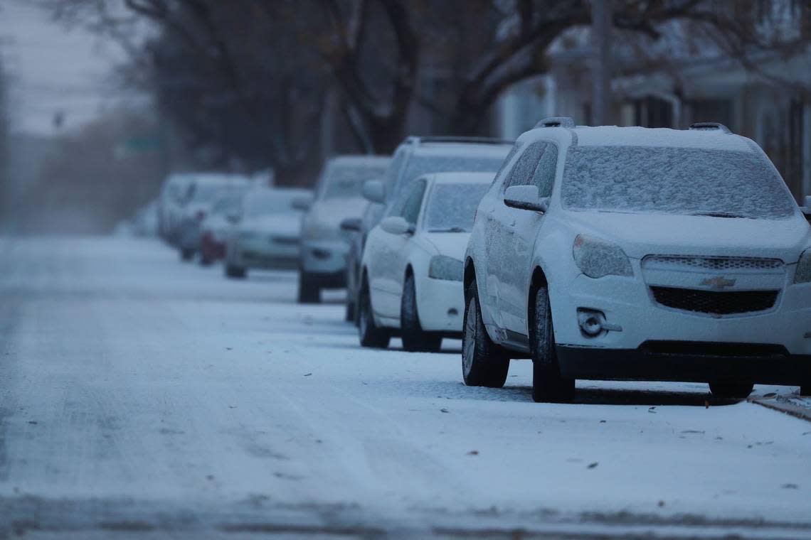 Snow covers parked cars in Lexington, Ky., as the city deals with an arctic front on Dec. 23, 2022.