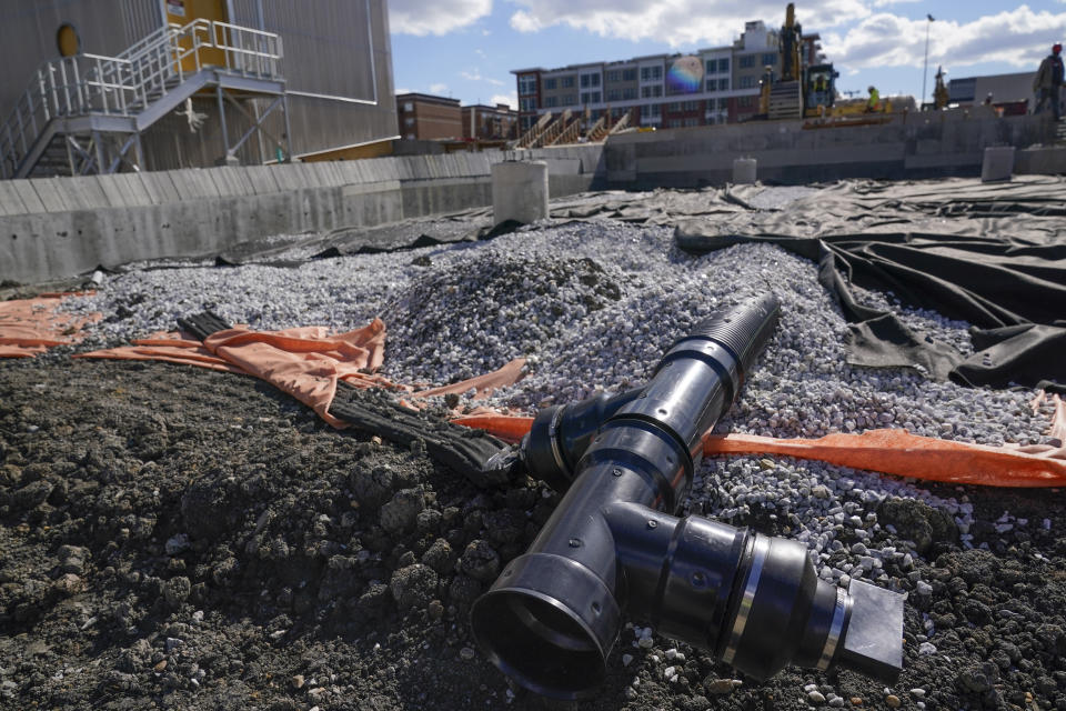 A section of the underground drainage system is visible during construction at a "resiliency park" in Hoboken, N.J., Wednesday, Oct. 19, 2022. Hoboken has built two such parks, designed to flood during storms by capturing water that would otherwise flow into the streets and sewer systems, with three others to come. They can hold millions of gallons of storm water, including through the use of large underground cisterns, one of which is the size of a city block. (AP Photo/Seth Wenig)