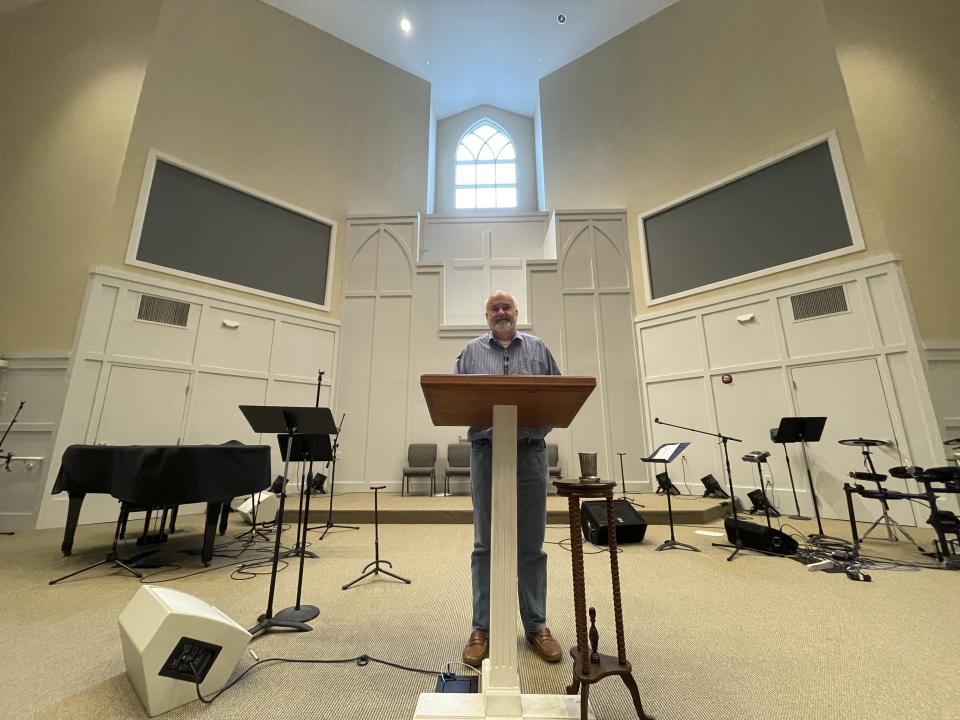 Pastor Jim Conrad stands in the Towne View Baptist Church in Kennesaw, Ga., on Thursday, Feb. 18, 2021. During a Southern Baptist Convention meeting in late February, its executive committee will discuss a recommendation that his church be ousted from the SBC because it accepted LGBTQ people into its congregation. (AP Photo/Angie Wang)