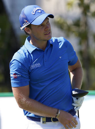 Danny Willett of England watches his tee off on the second hole during the Dubai Desert Classic golf championship February 7, 2016. REUTERS/Ahmed Jadallah