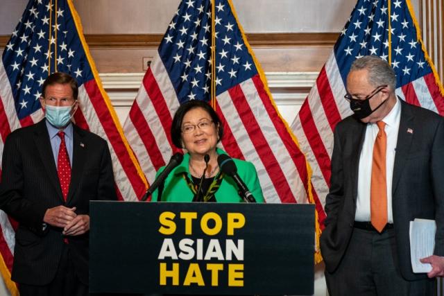 WASHINGTON, DC - APRIL 22: Sen. Mazie Hirono (D-HI), center, flanked by Sen. Richard Blumenthal, (D-CT), left, and Senate Majority Leader Chuck Schumer (D-NY), right, speaks during a news conference about the passage of S. 937, Covid-19 Hate Crimes Act on Capitol Hill on Thursday, April 22, 2021 in Washington, DC. The Bill passed, amended by a vote of 94-1, with Sen. Josh Hawley was the lone vote against. (Kent Nishimura / Los Angeles Times)