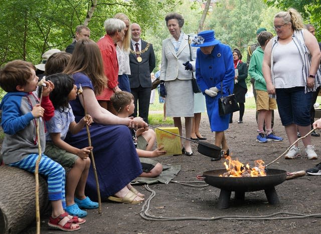 The Queen views marshmallows being toasted 